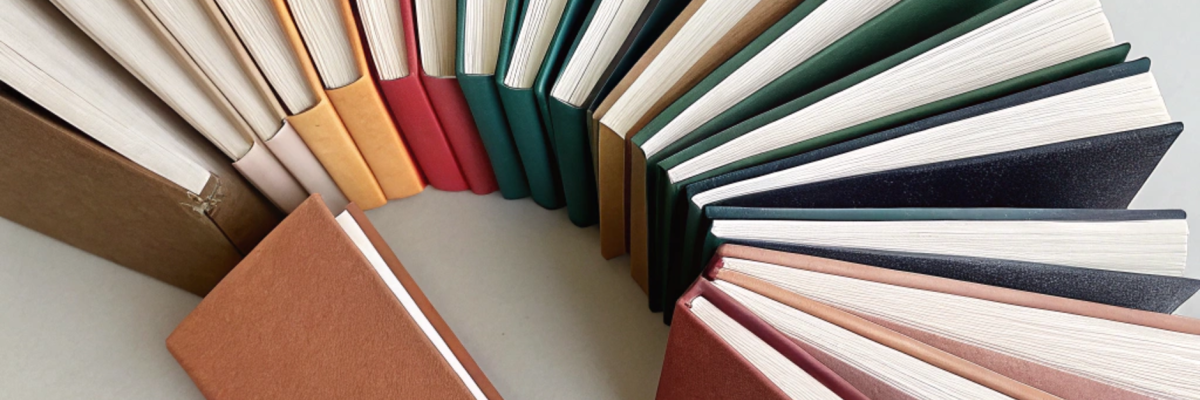 minimalist-scene-of-thin-thesis-style-books-with-p Minimalist scene of thin thesis style books with p